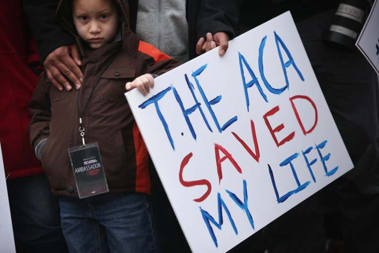 WASHINGTON, DC - MARCH 04: Five-year-old James Cook of Cleveland, Ohio, participates in a rally to support the Affordable Care Act in front of the U.S Supreme Court March 4, 2015 in Washington, DC. The Supreme Court was scheduled to hear oral arguments in the case of King v. Burwell that could determine the fate of health care subsidies for as many as eight million people. (Photo by Alex Wong/Getty Images) ORG XMIT: 541152493 ORG XMIT: CST1503040935521907